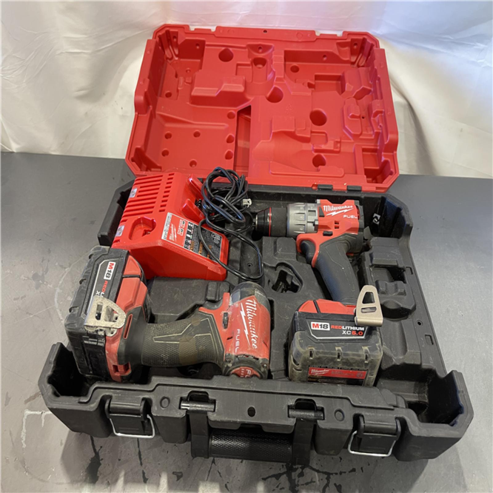 AS-IS - Milwaukee M18 FUEL 18V Lithium-Ion Brushless Cordless Hammer Drill and Impact Driver Combo Kit