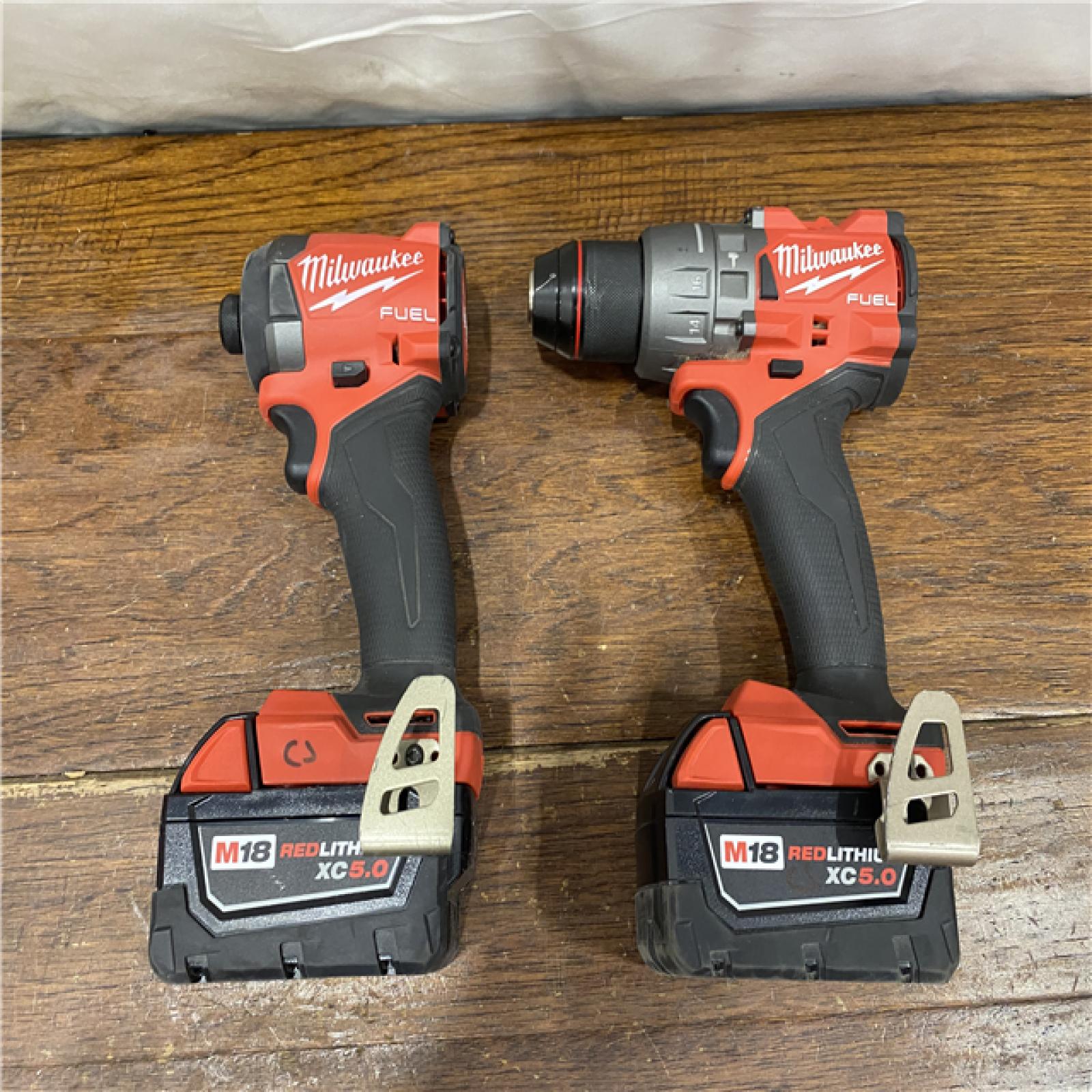 AS-IS MILWAUKEE M18 FUEL 18V Lithium-Ion Brushless Cordless Hammer Drill and Impact Driver Combo Kit (2-Tool) with 2 Batteries