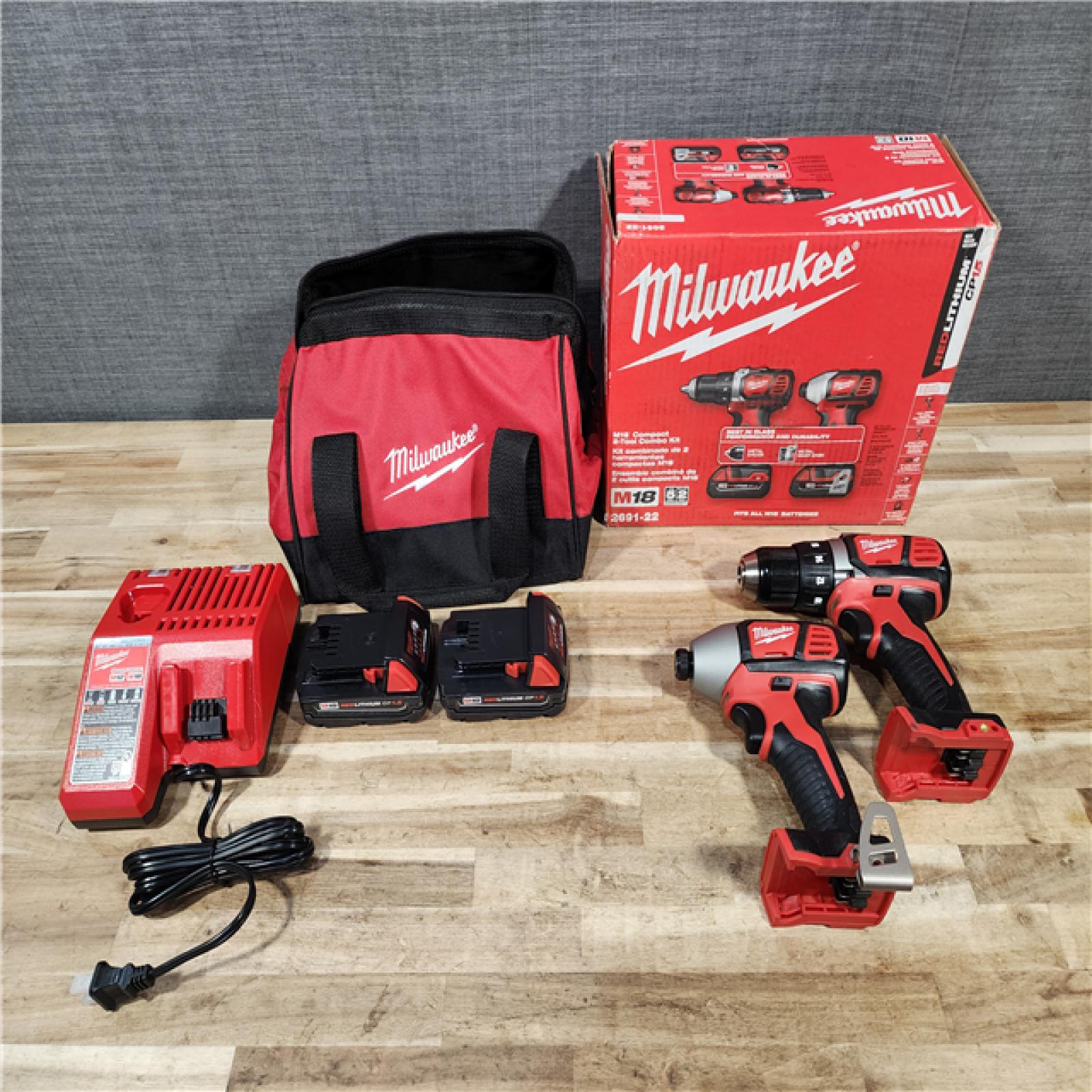HOUSTON LOCATION - AS-IS Milwaukee M18 18V Lithium-Ion Cordless Drill Driver/Impact Driver Combo Kit