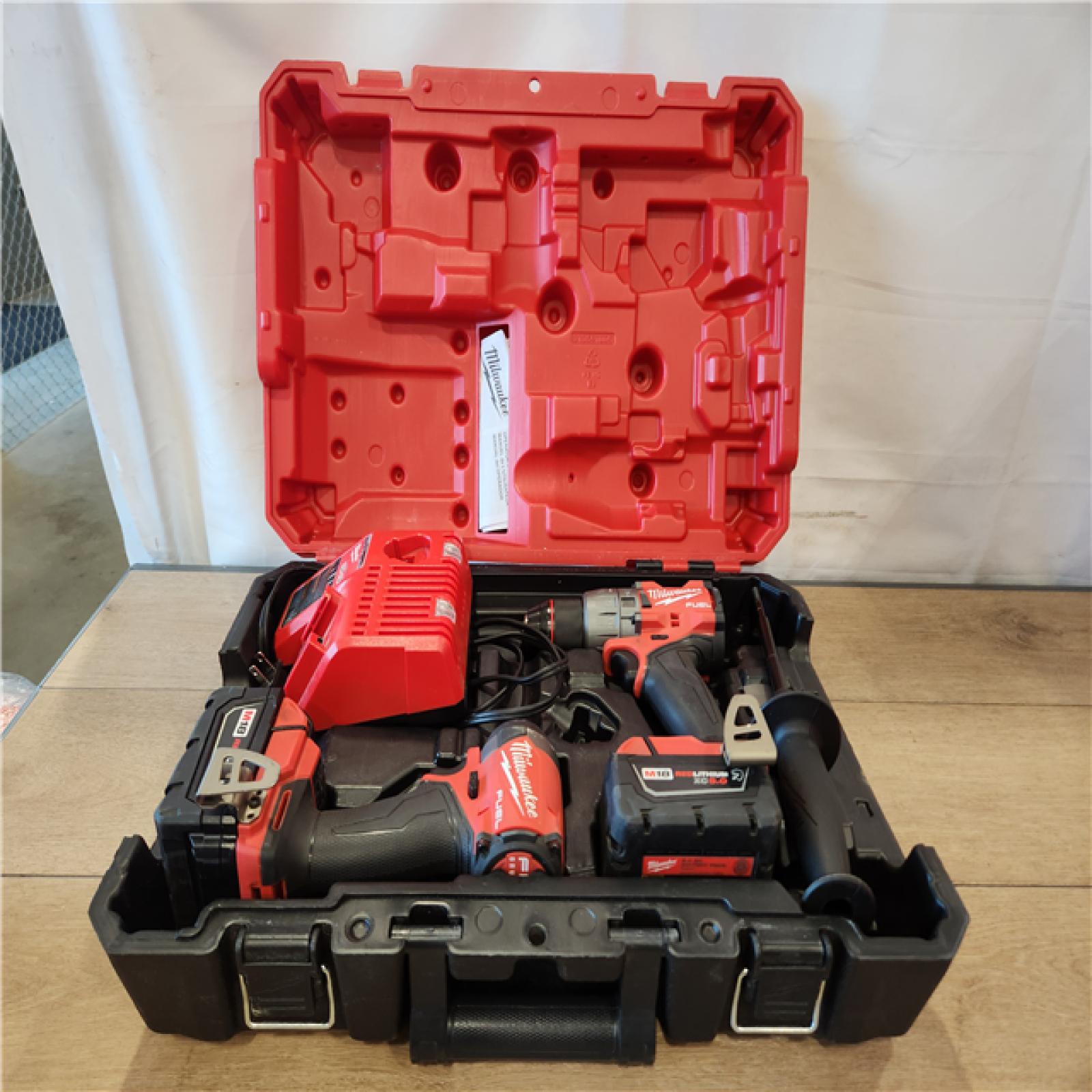 AS-IS- Milwaukee FUEL 18V Lithium-Ion Brushless Cordless Hammer Drill and Impact Driver Combo Kit