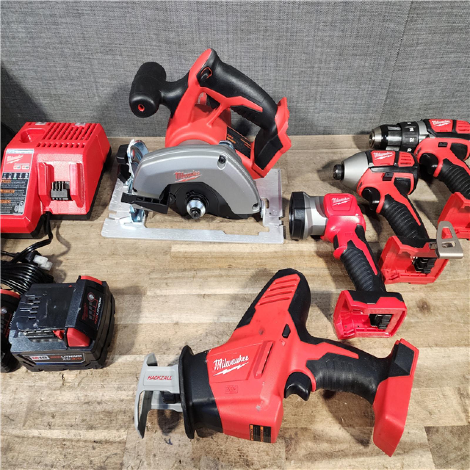 HOUSTON LOCATION - AS-IS Milwaukee M18 18-Volt Lithium-Ion Cordless Combo Tool Kit (5-Tool) with (1) 3.0Ah and (1) 1.5Ah Battery  (1) Charger  (1) Tool Bag