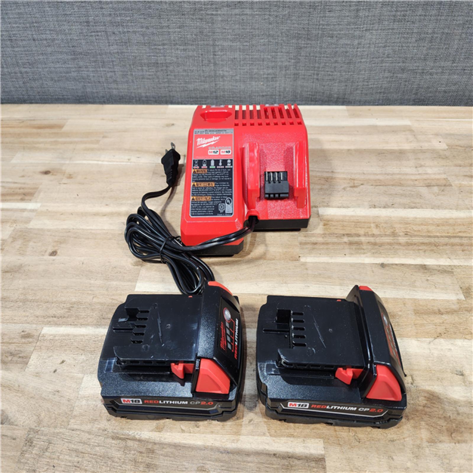 HOUSTON LOCATION - AS-IS MILWAUKEE 2 TOOL COMBO KIT W/ (2) BATTERY & CHARGER