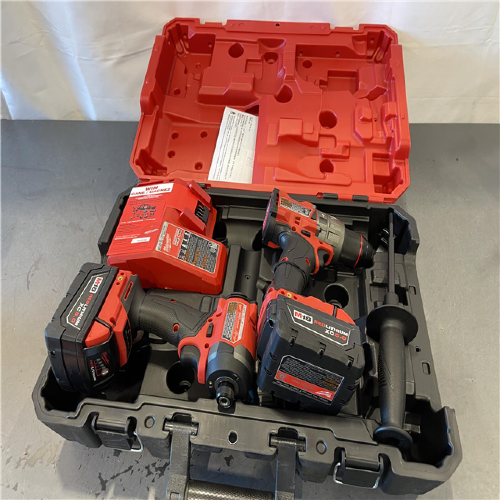 AS-IS - MILWAUKEE FUEL 18V Lithium-Ion Brushless Cordless Hammer Drill and Impact Driver Combo Kit