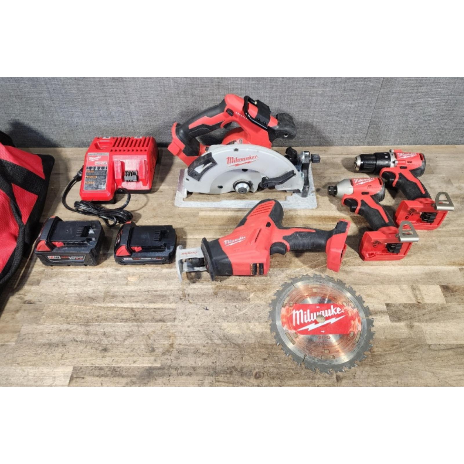 HOUSTON LOCATION - AS-IS Milwaukee M18 18-Volt Lithium-Ion Brushless Cordless Combo Kit (4-Tool) with 2-Batteries  1-Charger and Tool Bag
