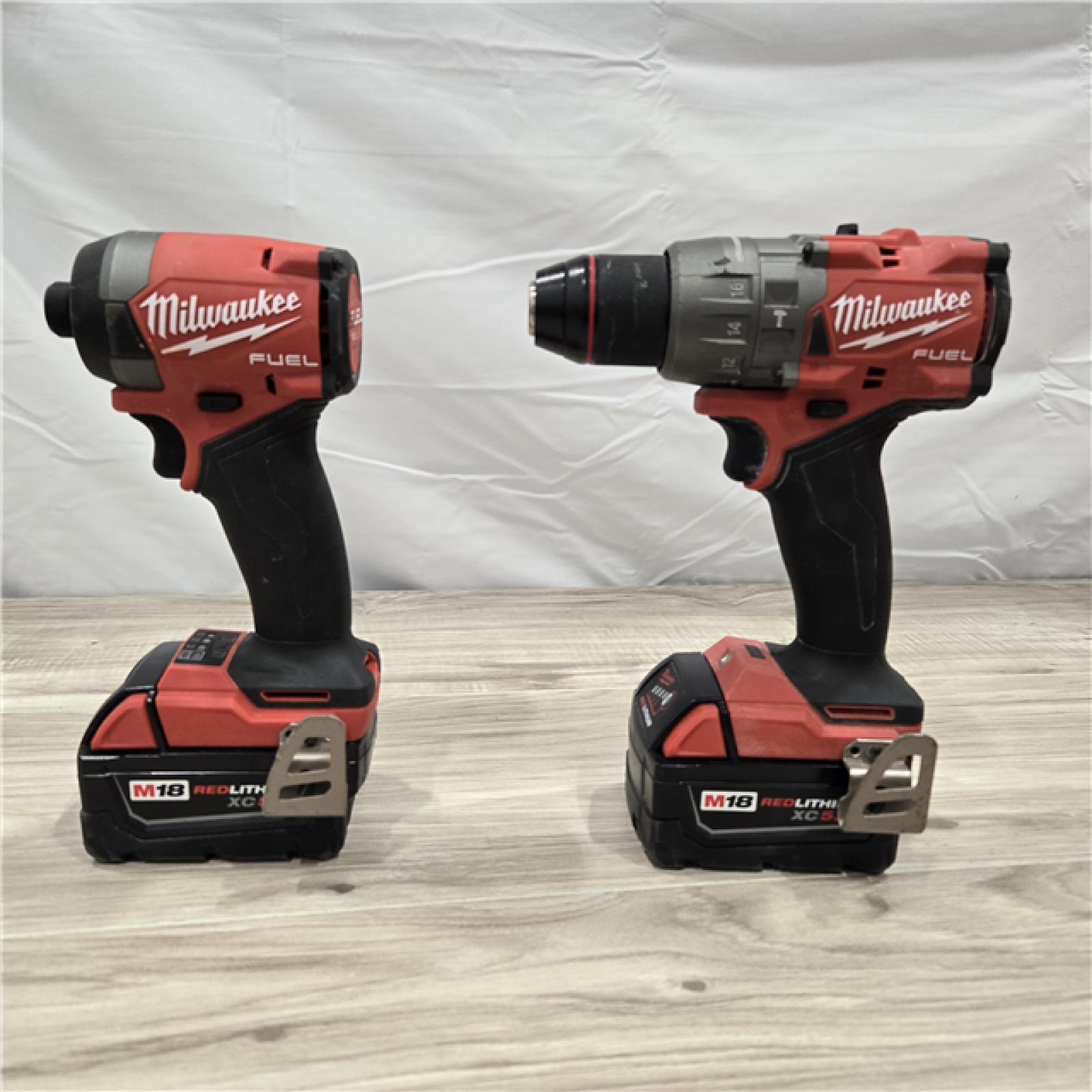 AS-IS MILWAUKEE FUEL 18V Lithium-Ion Brushless Cordless Hammer Drill and Impact Driver Combo Kit (2-Tool) with 2 Batteries