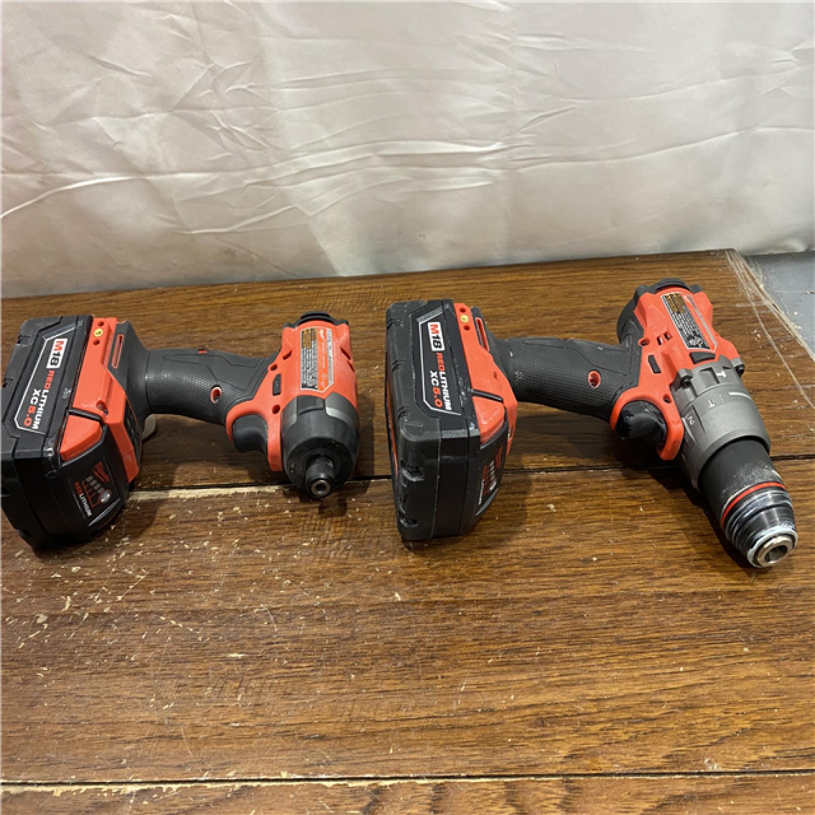 AS-IS MILWAUKEE M18 FUEL 18V Lithium-Ion Brushless Cordless Hammer Drill and Impact Driver Combo Kit (2-Tool) with 2 Batteries