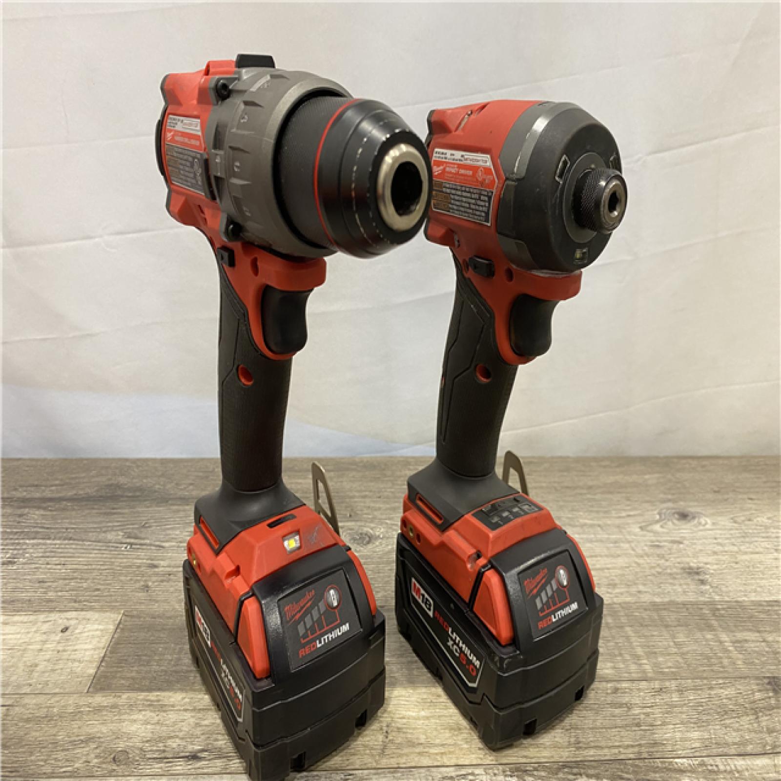 AS-IS Milwaukee FUEL 18V Lithium-Ion Brushless Cordless Hammer Drill and Impact Driver Combo Kit (2-Tool) with 2 Batteries