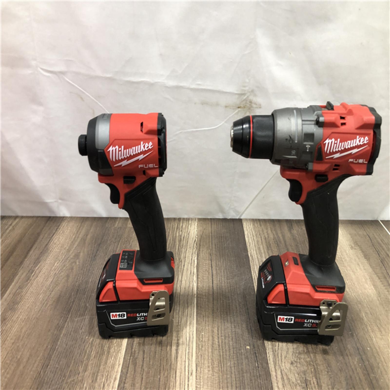 AS-IS Milwaukee FUEL 18V Lithium-Ion Brushless Cordless Hammer Drill and Impact Driver Combo Kit