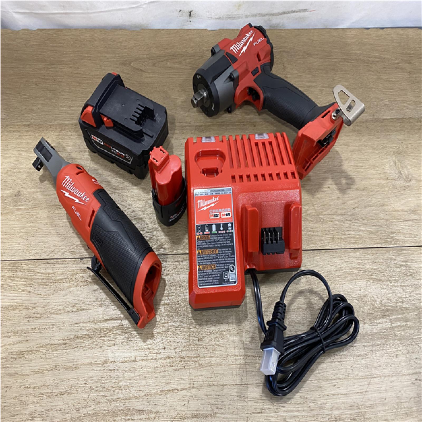 AS-IS - Milwaukee FUEL 18V Cordless Mid Torque 1/2 in. Impact Wrench w/ 12 FUEL 3/8 in. Ratchet Combo Kit