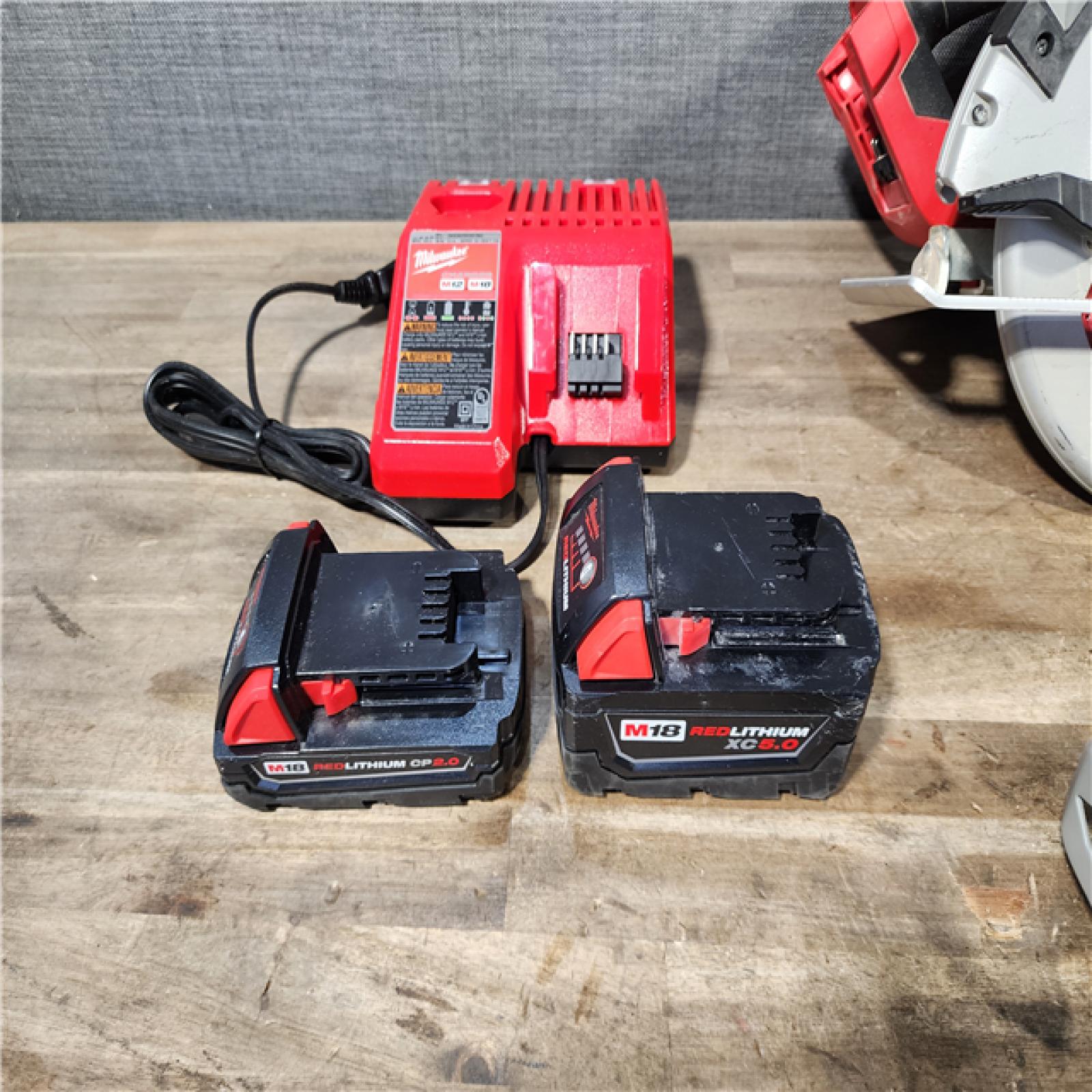HOUSTON LOCATION - AS-IS Milwaukee M18 18-Volt Lithium-Ion Brushless Cordless Combo Kit (4-Tool) with 2-Batteries  1-Charger