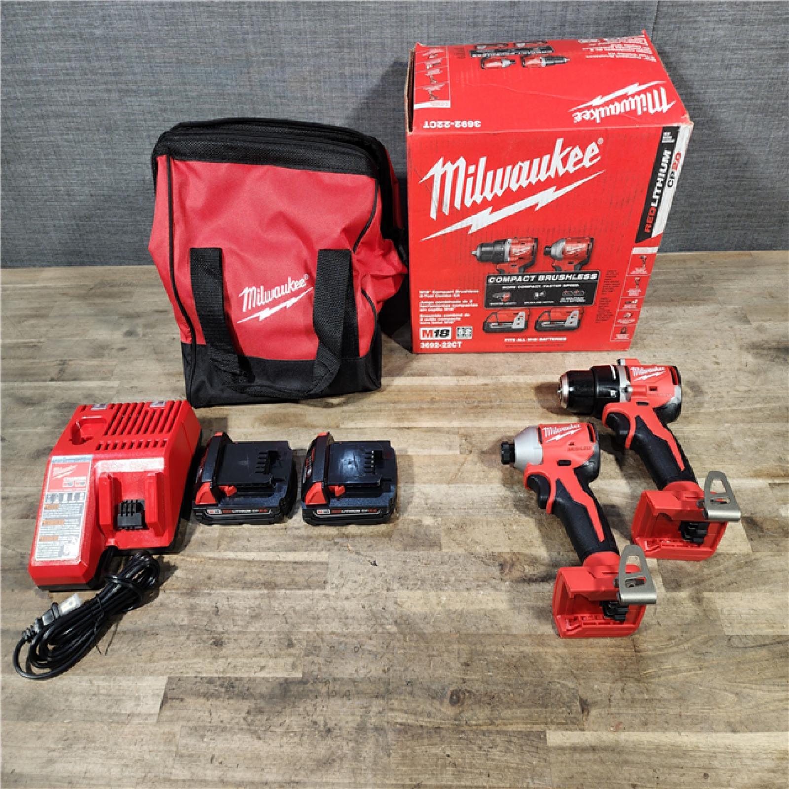 HOUSTON LOCATION - AS-IS Milwaukee M18 18V Lithium-Ion Brushless Cordless Compact Drill/Impact Combo Kit (2-Tool) W/(2) 2.0 Ah Batteries  Charger & Bag