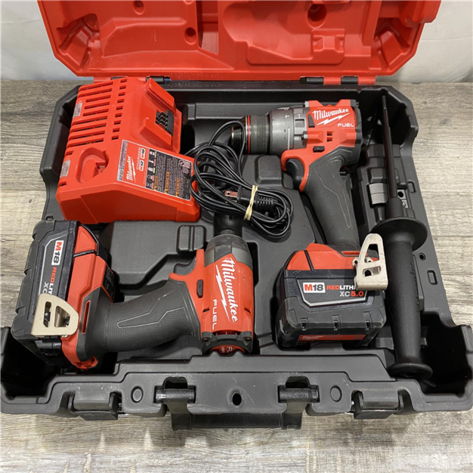 AS-IS Milwaukee FUEL 18V Lithium-Ion Brushless Cordless Hammer Drill and Impact Driver Combo Kit