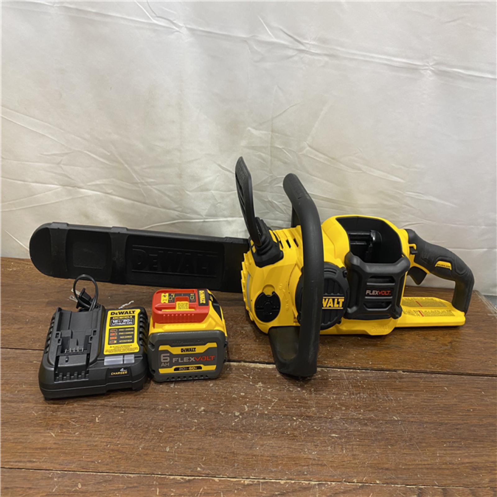 AS-IS DEWALT  FLEXVOLT 60V MAX 16in. Brushless Cordless Battery Powered Chainsaw Kit with (1) FLEXVOLT 2 Ah Battery & Charger