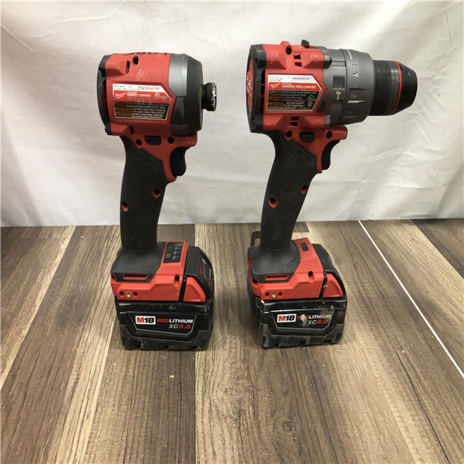 AS-IS Milwaukee FUEL 18V Lithium-Ion Brushless Cordless Hammer Drill and Impact Driver Combo Kit