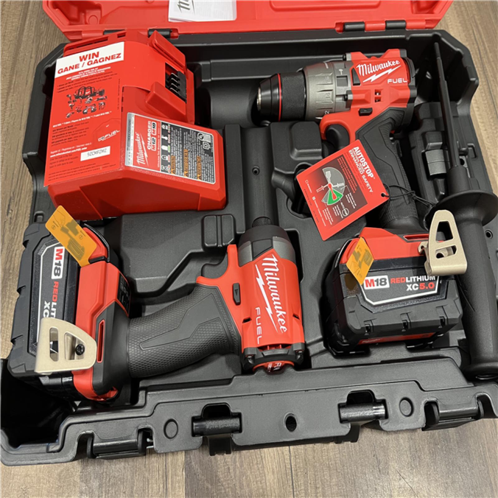 AS-IS Milwaukee M18 FUEL 18V Lithium-Ion Brushless Cordless Hammer Drill and Impact Driver Combo Kit (2-Tool) with 2 Batteries