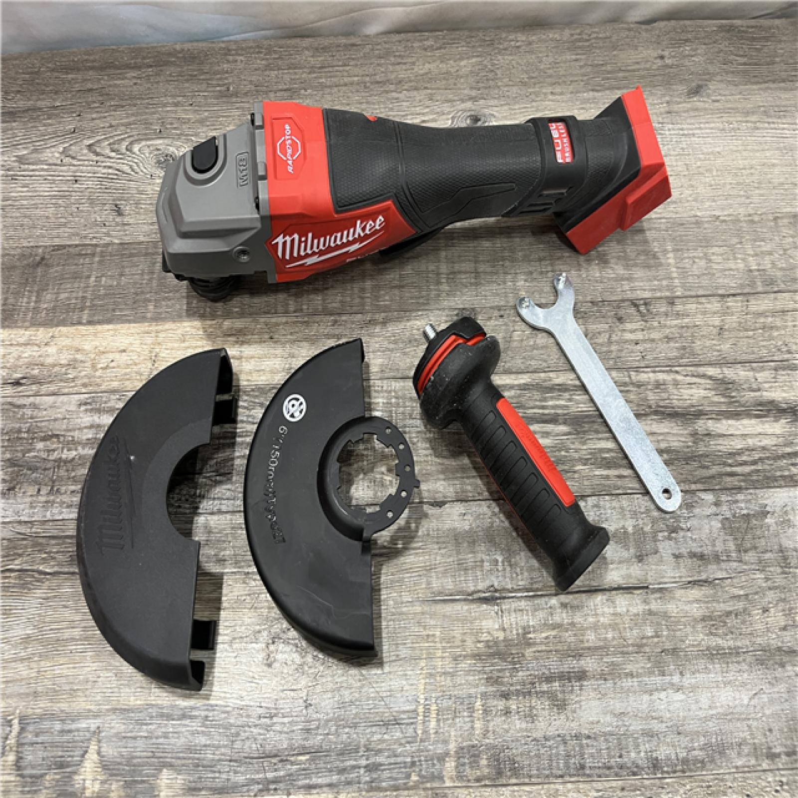 AS-IS Milwaukee FUEL 18-Volt Lithium-Ion Brushless Cordless 4-1/2 in./6 in. Braking Grinder with Paddle Switch (Tool-Only)