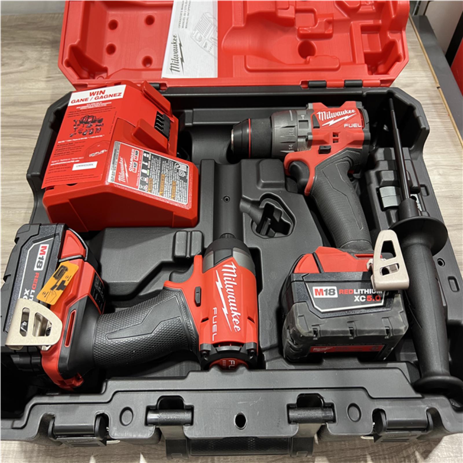 AS-IS Milwaukee FUEL 18V Lithium-Ion Brushless Cordless Hammer Drill and Impact Driver Combo Kit