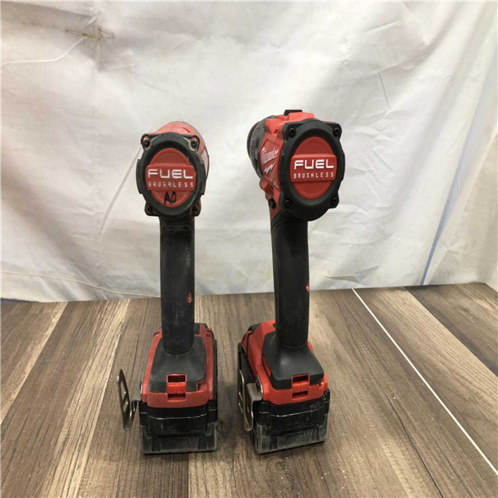 AS-IS Milwaukee FUEL 18V Lithium-Ion Brushless Cordless Hammer Drill and Impact Driver Combo Kit