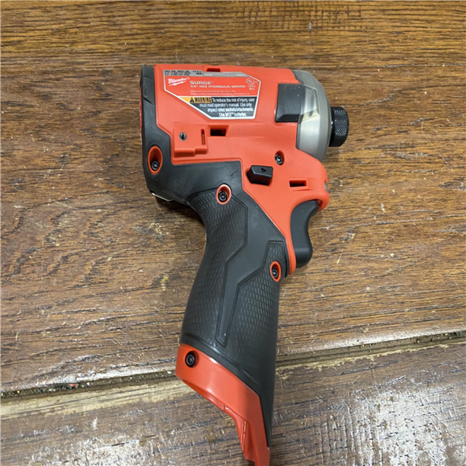 AS-IS M12 FUEL SURGE 12V Lithium-Ion Brushless Cordless 1/4 in. Hex Impact Driver Compact Kit W/Two 2.0Ah Batteries, Bag