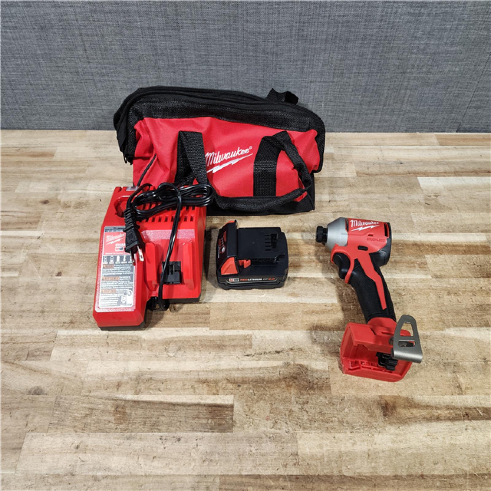 HOUSTON LOCATION - AS - IS Milwaukee 18-Volt Lithium-Ion Compact Brushless Cordless 1/4 in. Impact Driver Kit