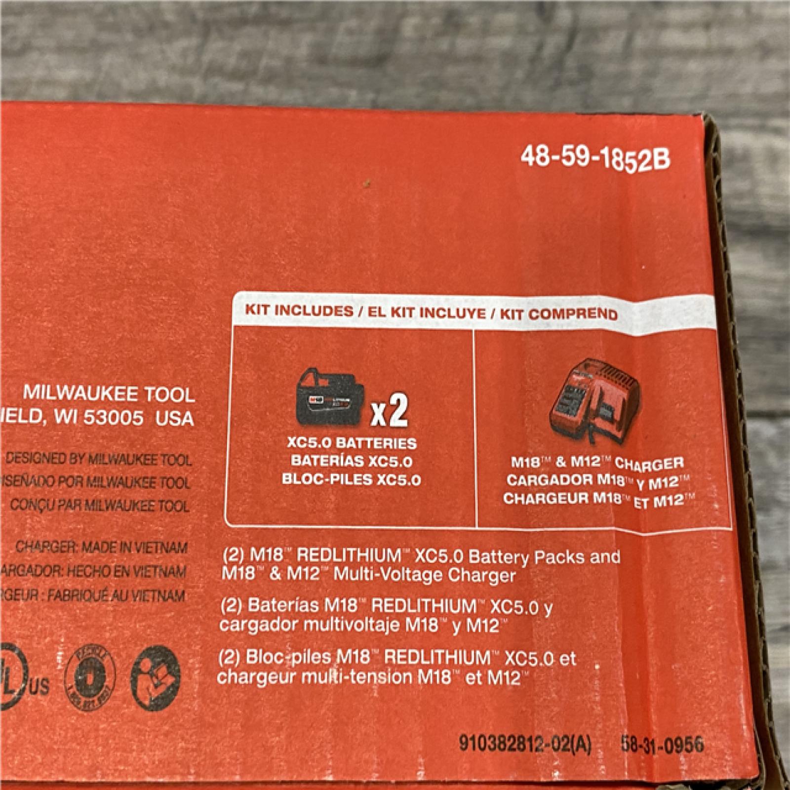 NEW - Milwaukee 18-Volt Lithium-Ion XC Starter Kit with Two 5.0Ah Batteries and Charger