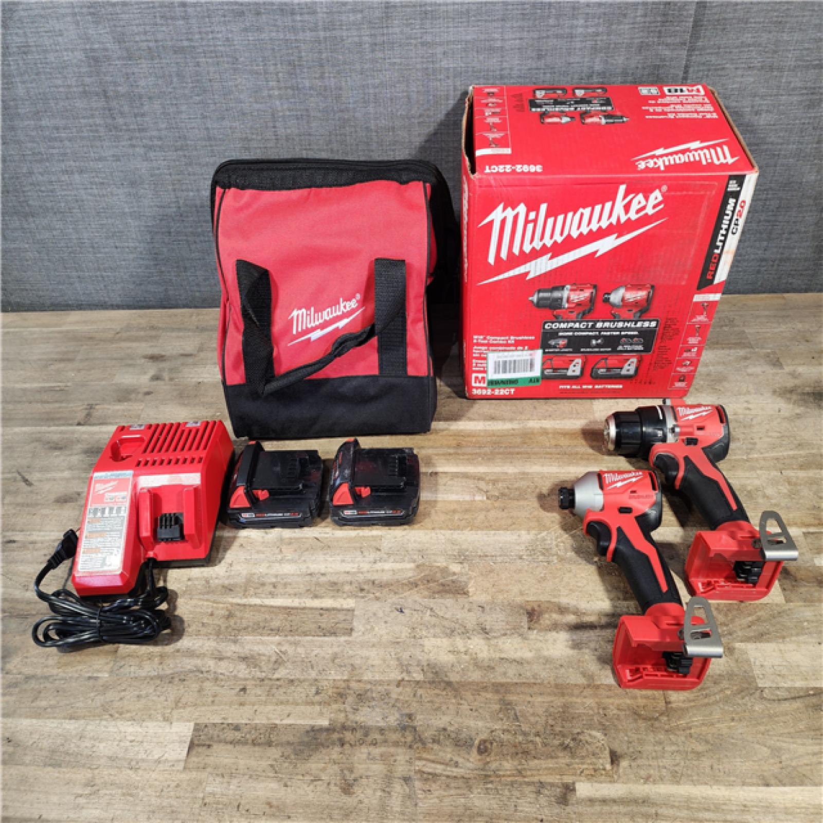 HOUSTON LOCATION - AS-IS Milwaukee M18 18V Lithium-Ion Brushless Cordless Compact Drill/Impact Combo Kit (2-Tool) W/(2) 2.0 Ah Batteries  Charger & Bag