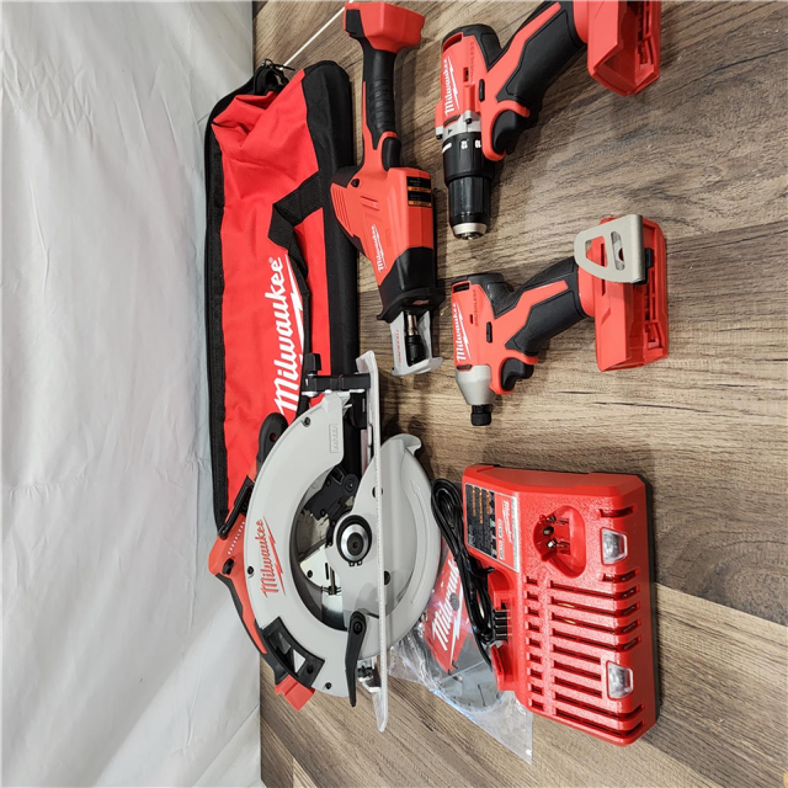AS-IS Milwaukee M18 18-Volt Lithium-Ion Brushless Cordless Combo Kit (4-Tool) with 2-Batteries, 1-Charger and Tool Bag