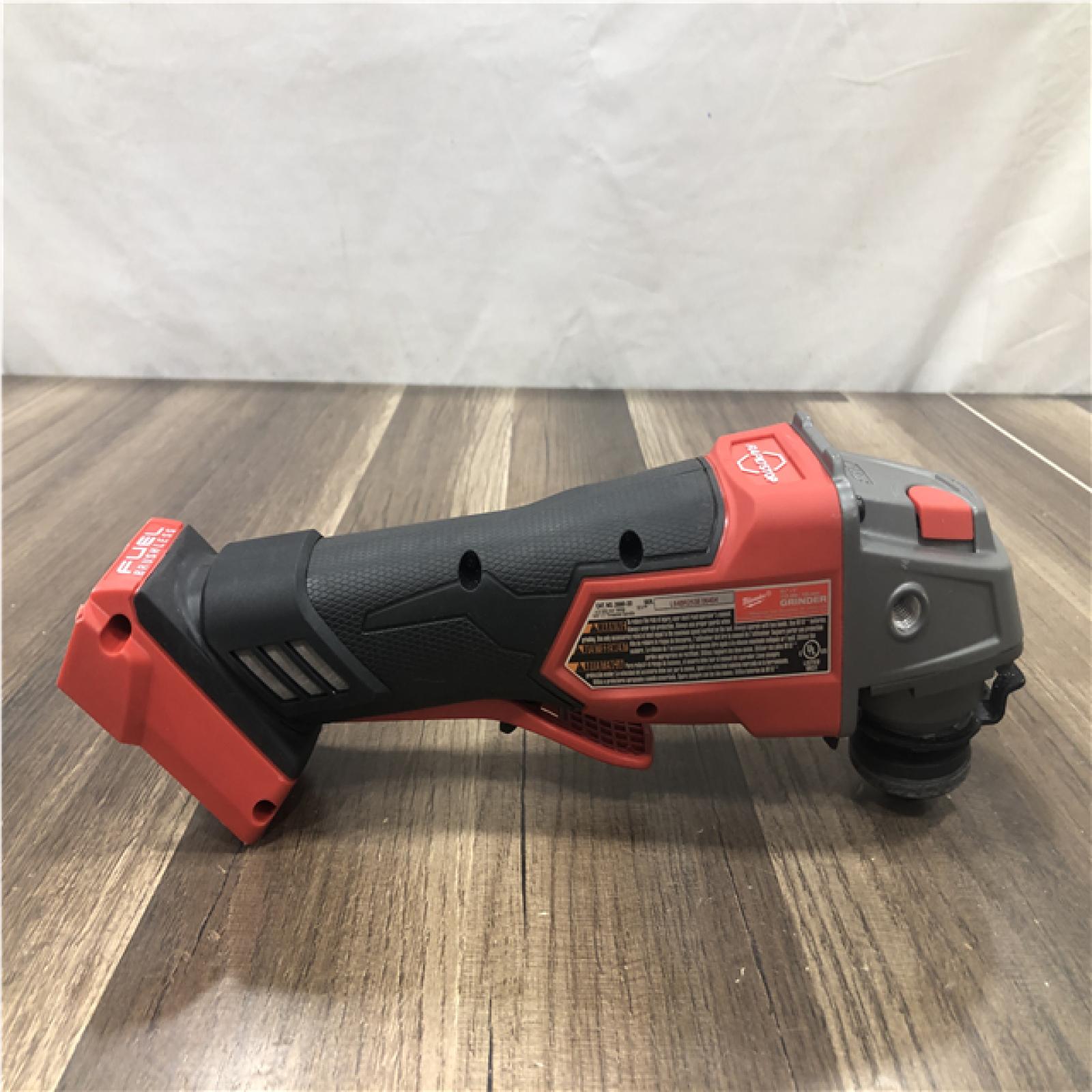 AS-IS Milwaukee FUEL 18V Lithium-Ion Brushless Cordless 4-1/2 in./5 in. Grinder w/Paddle Switch (Tool-Only)