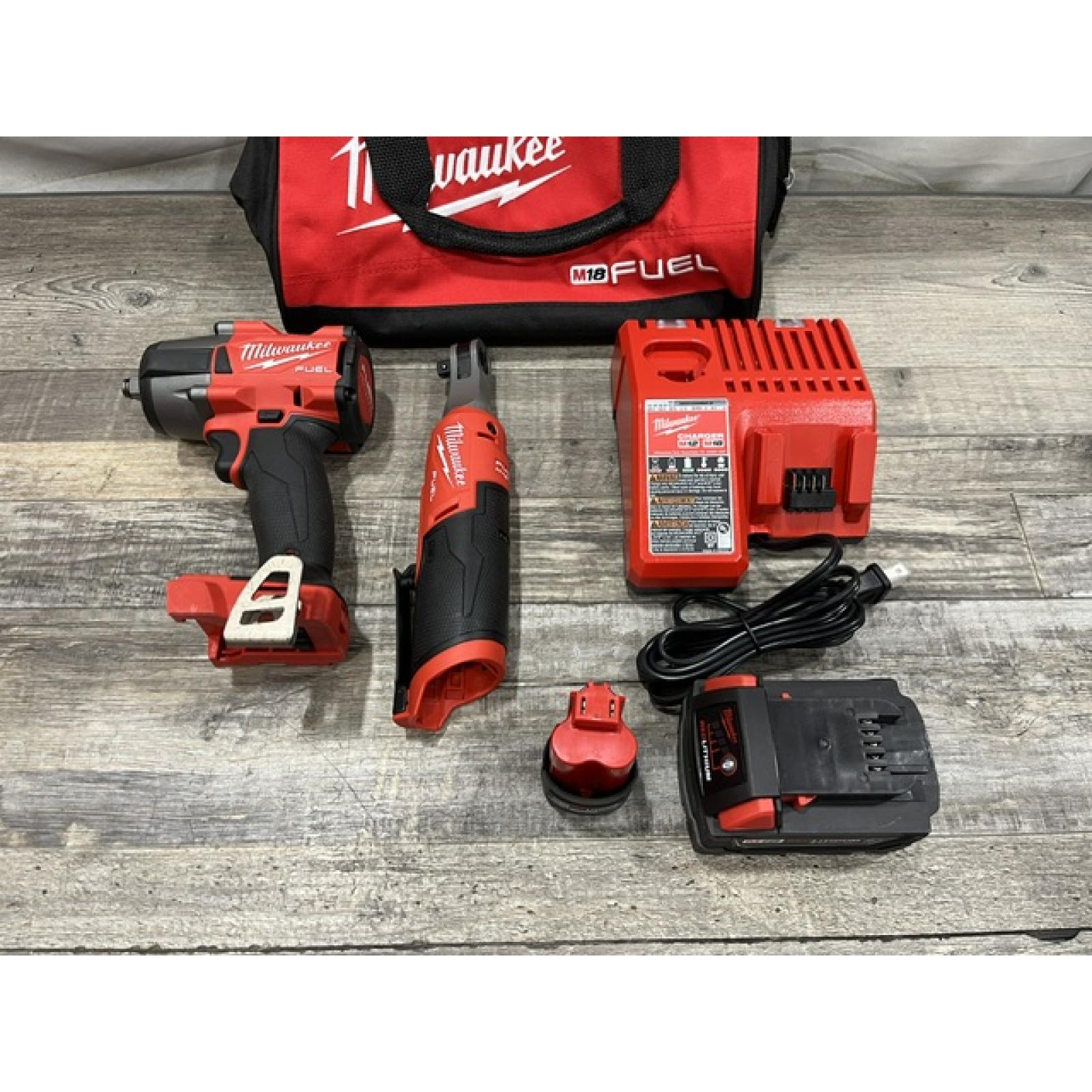 AS-IS Milwaukee FUEL 18V Cordless Mid Torque 1/2 in. Impact Wrench w/ 12 FUEL 3/8 in. Ratchet Combo Kit