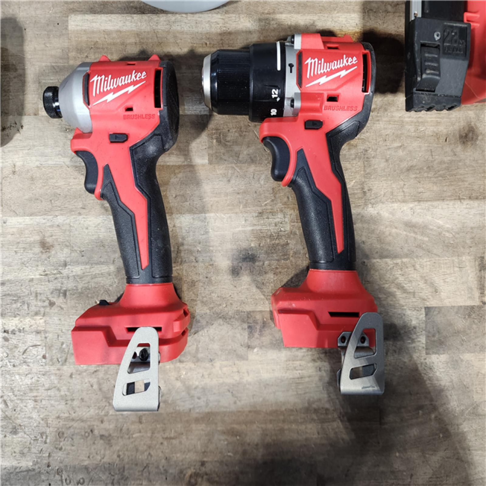 HOUSTON LOCATION - AS-IS Milwaukee M18 18-Volt Lithium-Ion Brushless Cordless Combo Kit (4-Tool) with 2-Batteries  1-Charger and Tool Bag
