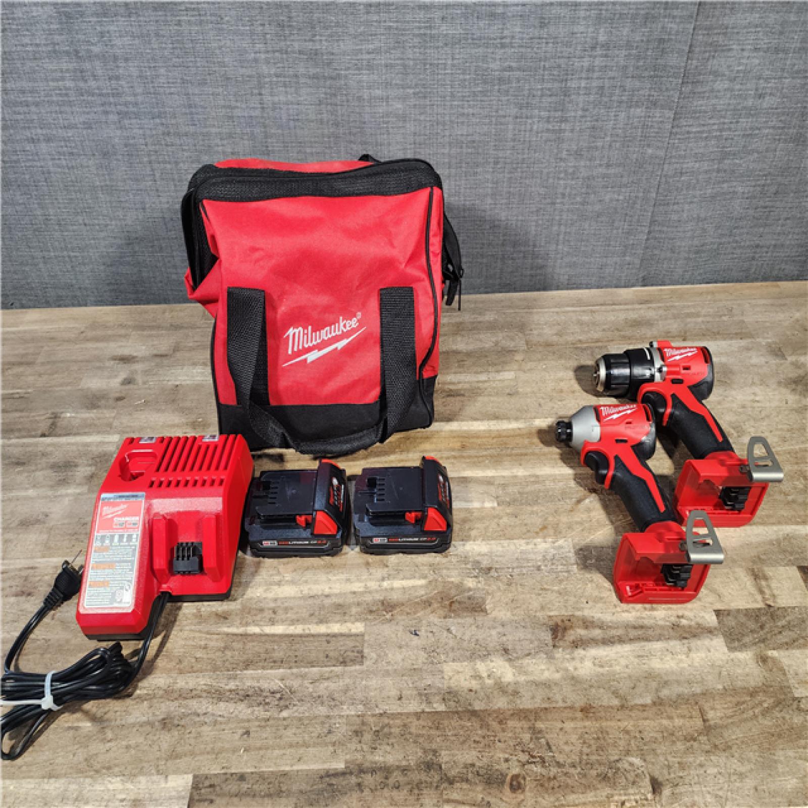 HOUSTON LOCATION - AS-IS Milwaukee M18 18V Lithium-Ion Brushless Cordless Compact Drill/Impact Combo Kit (2-Tool) W/(2) 2.0 Ah Batteries  Charger & Bag