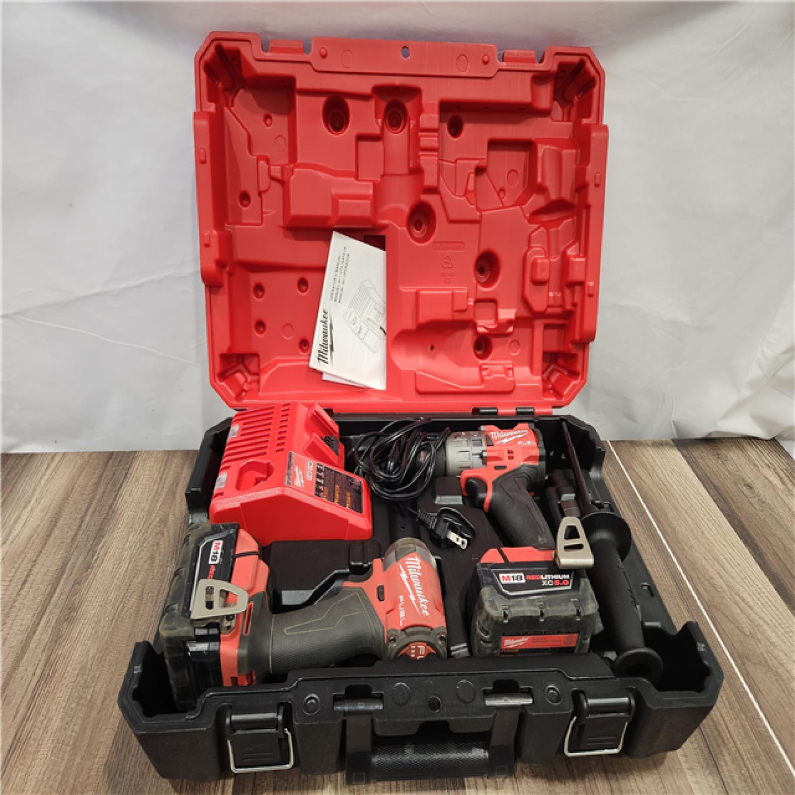 AS-IS Milwaukee M18 FUEL 18V Lithium-Ion Brushless Cordless Hammer Drill and Impact Driver Combo Kit (2-Tool)