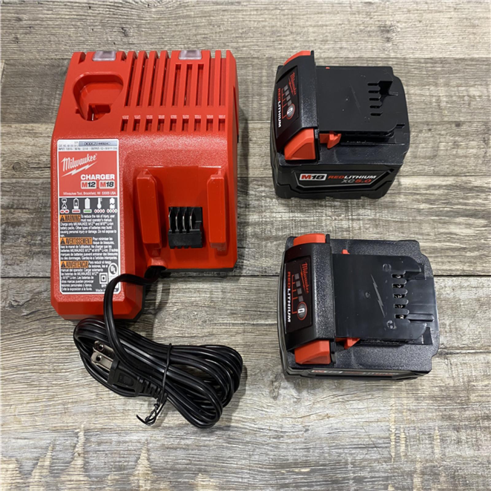 AS-IS Milwaukee 18-Volt Lithium-Ion XC Starter Kit with Two 5.0Ah Batteries and Charger