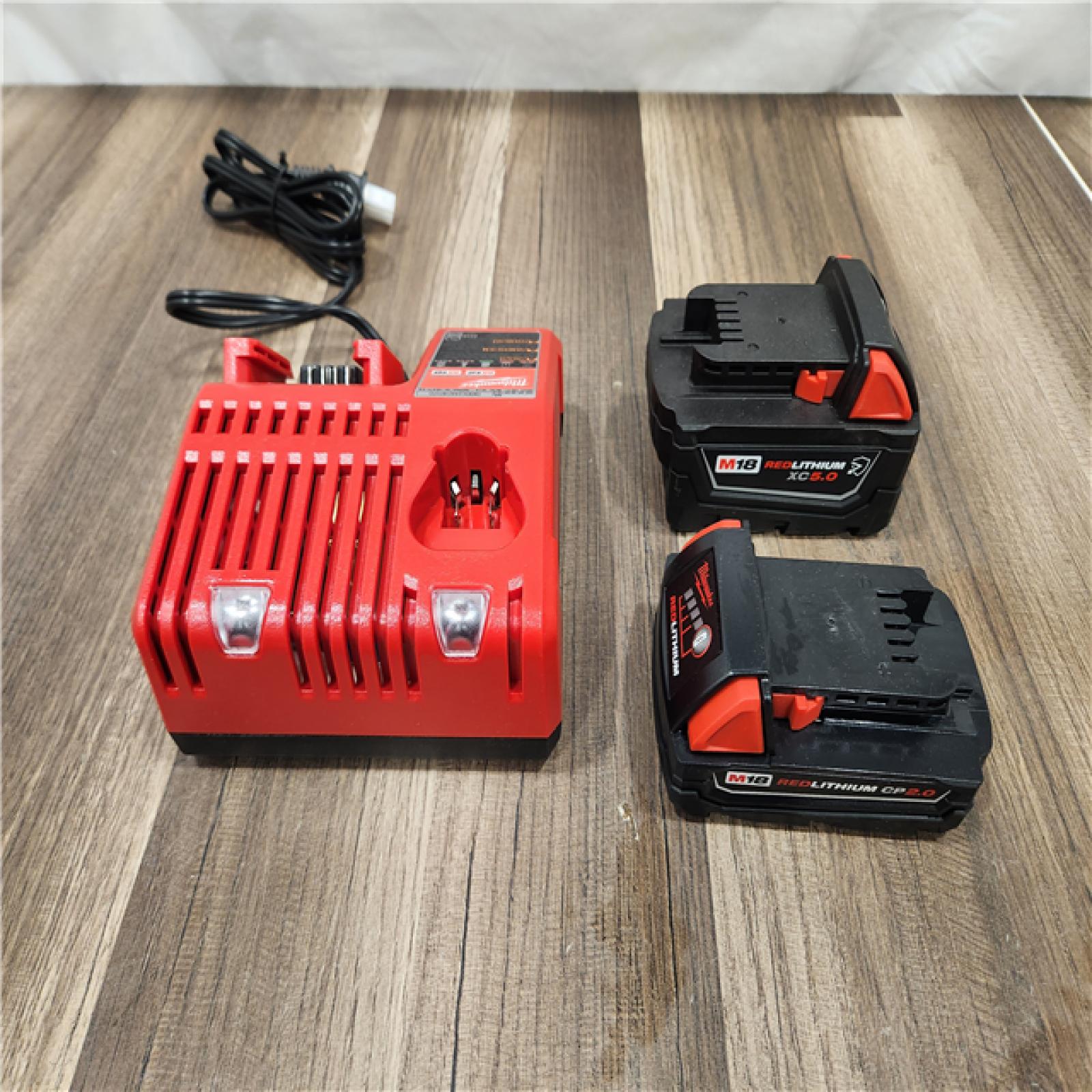 AS-IS Milwaukee M18 18-Volt Lithium-Ion Starter Kit with One 5.0 Ah and One 2.0 Ah Battery and Charger
