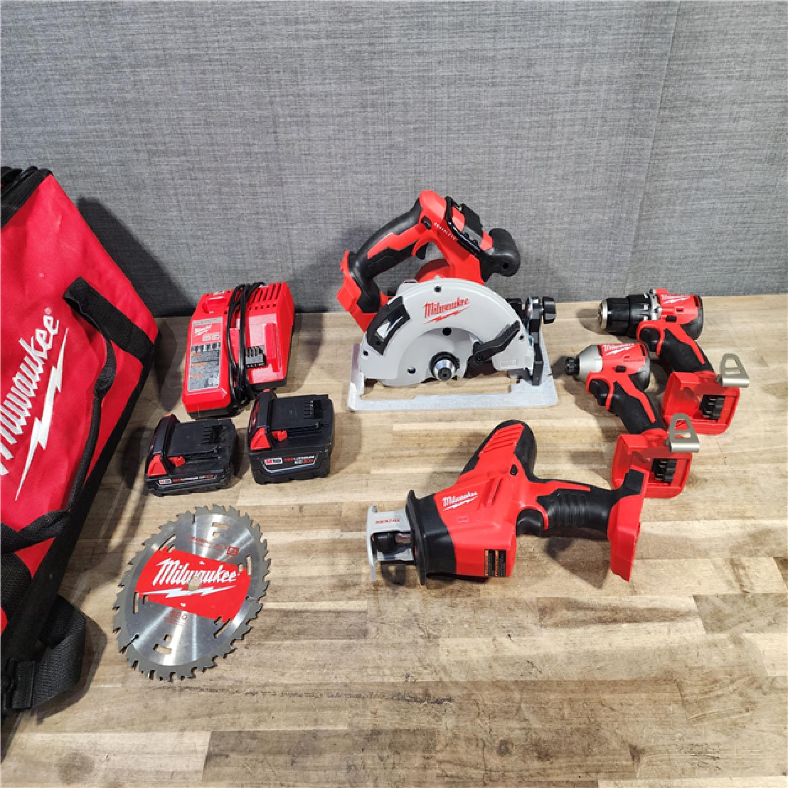 HOUSTON LOCATION - AS-IS MILWAUKEE 4 TOOL COMBO KIT W/ (2) BATTERY & CHARGER
