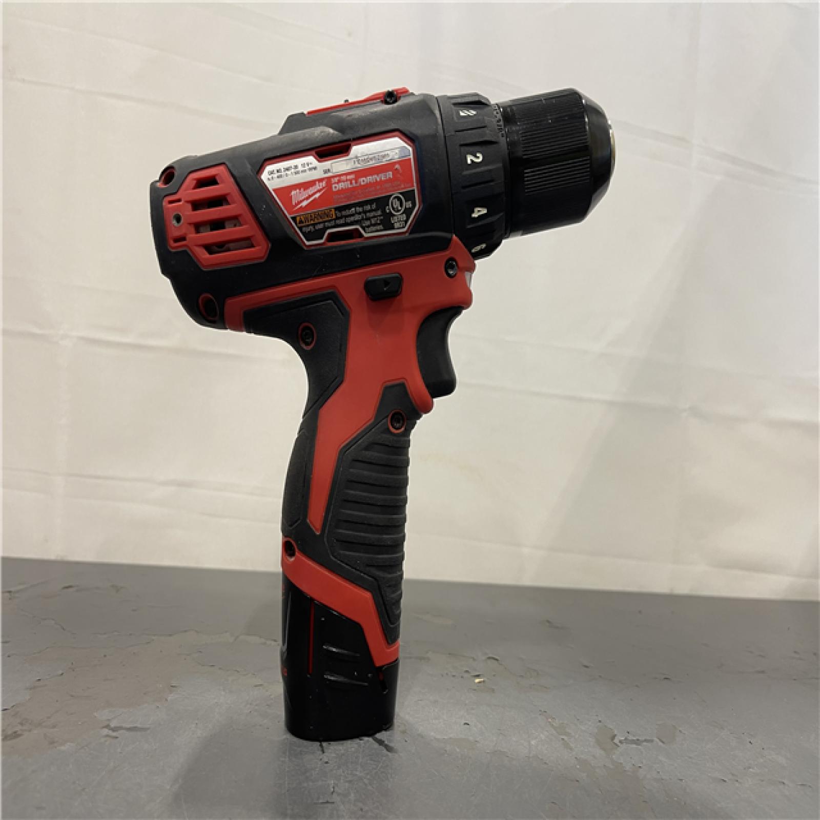 AS-IS - MILWAUKEE M12 12V Lithium-Ion Cordless 3/8 in. Drill/Driver Kit with Two 1.5 Ah Batteries, Charger and Tool Bag