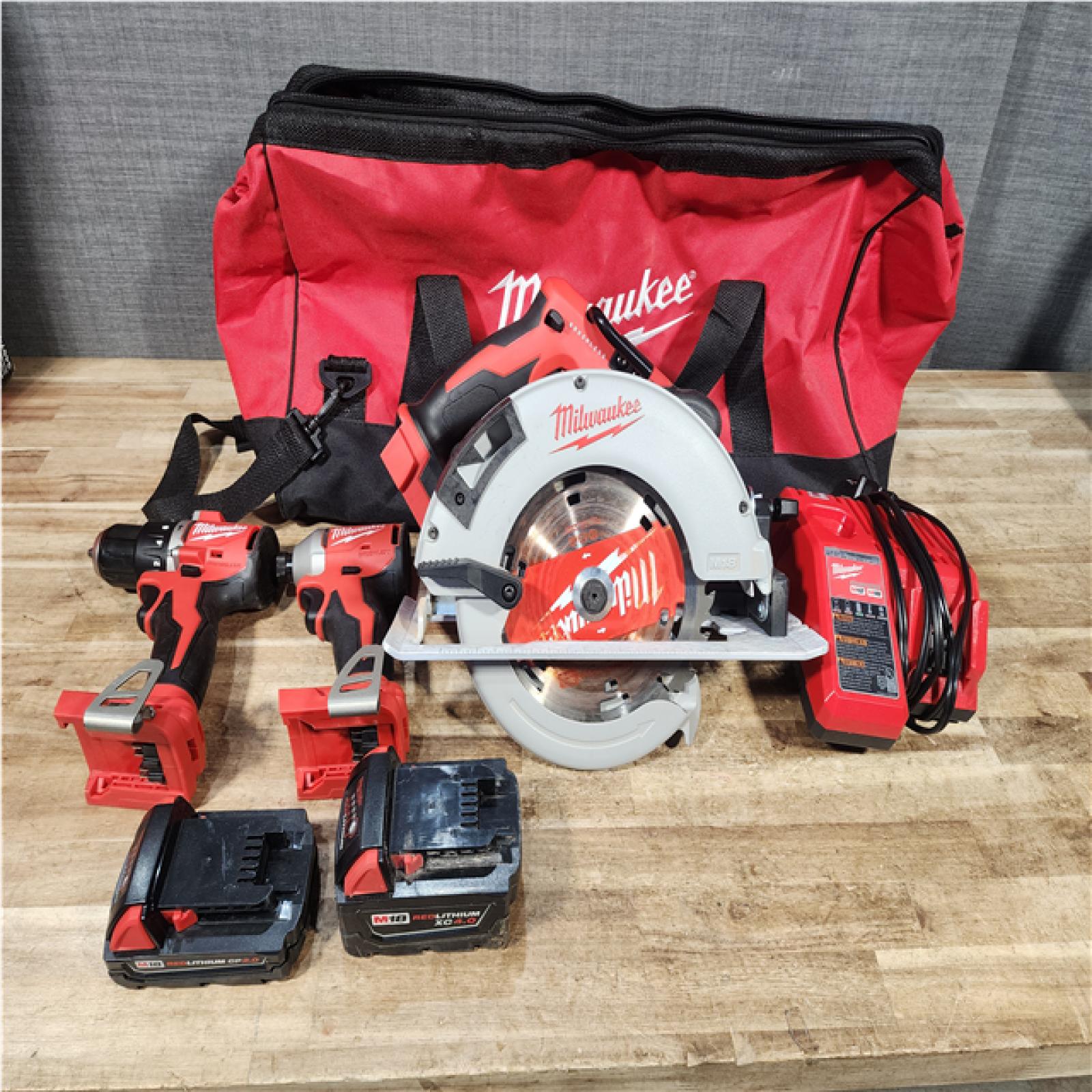 Houston Location AS-IS Milwaukee Drill and Impact and Circular Saw and Batteries QTY/2
