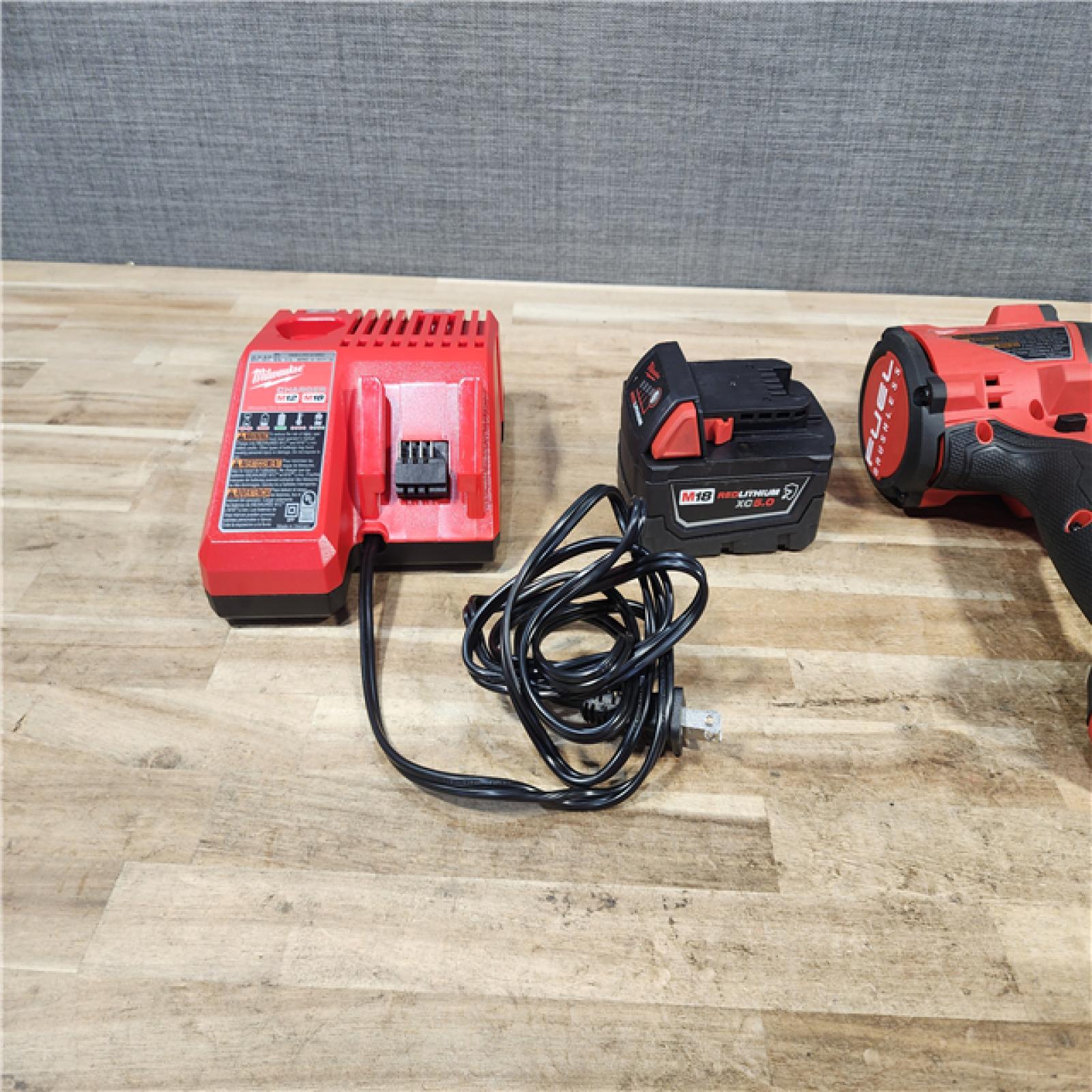 HOUSTON LOCATION - AS - IS Milwaukee FUEL 18V Lithium-Ion Brushless Cordless 1/2 in. Impact Wrench with Friction Ring W/ BATTERY & CHARGER