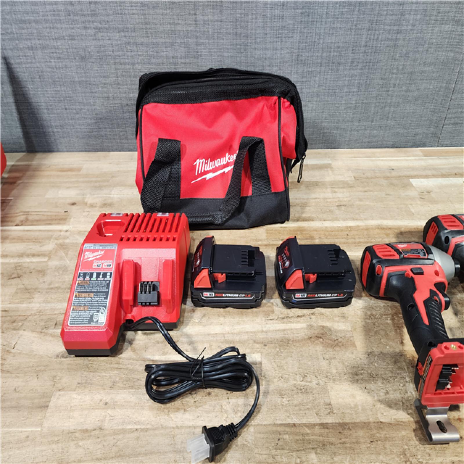 HOUSTON LOCATION - AS - IS Milwaukee 18V Lithium-Ion Cordless Drill Driver/Impact Driver Combo Kit