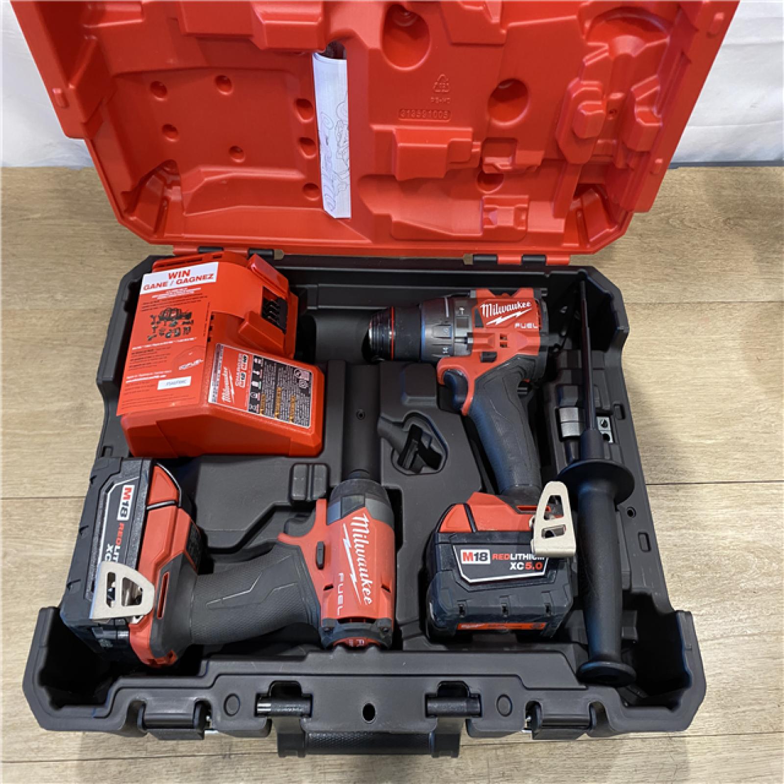 AS-IS Milwaukee FUEL 18V Lithium-Ion Brushless Cordless Hammer Drill and Impact Driver Combo Kit