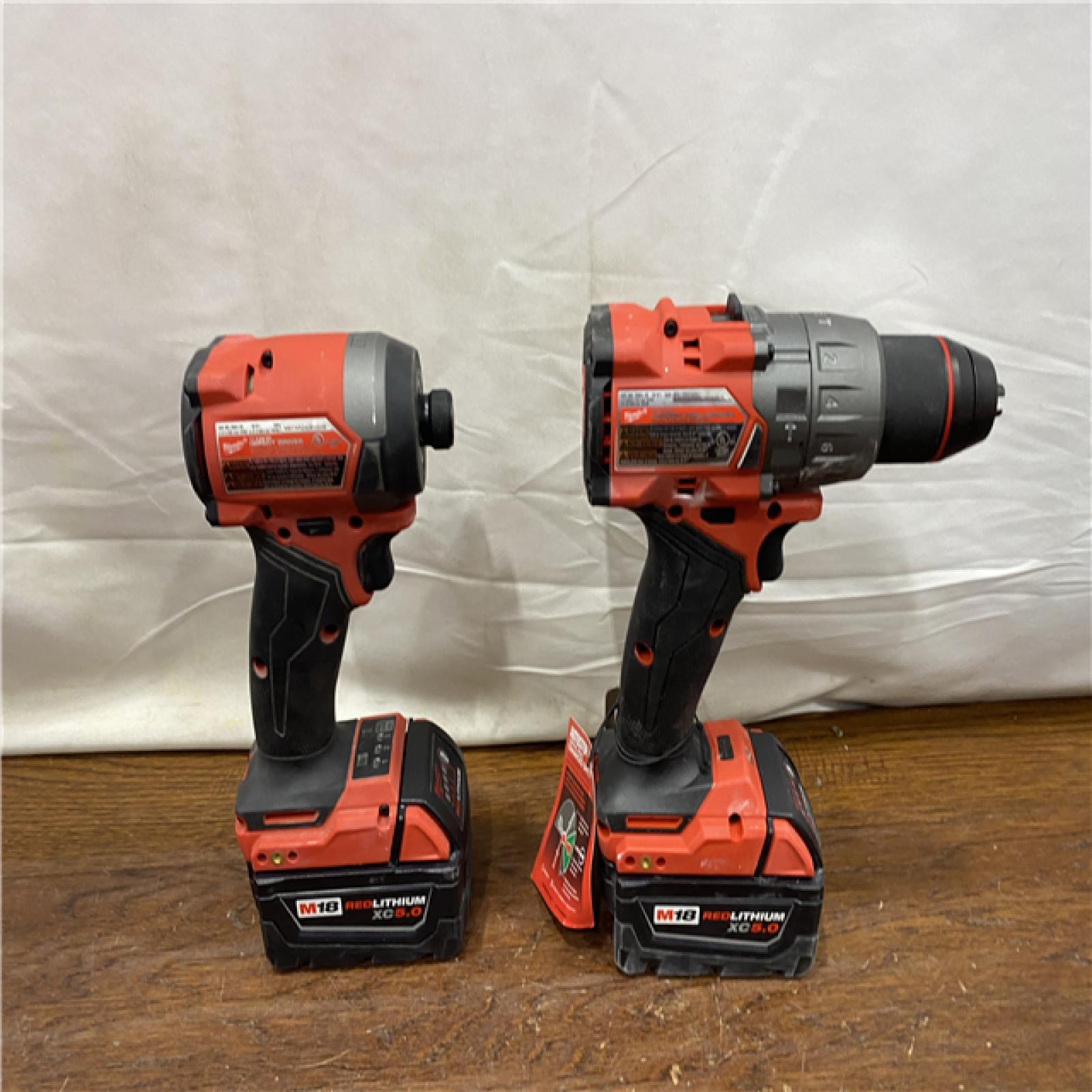 AS-IS MILWAUKEE M18 FUEL 18V Lithium-Ion Brushless Cordless Hammer Drill and Impact Driver Combo Kit (2-Tool) with 2 Batteries