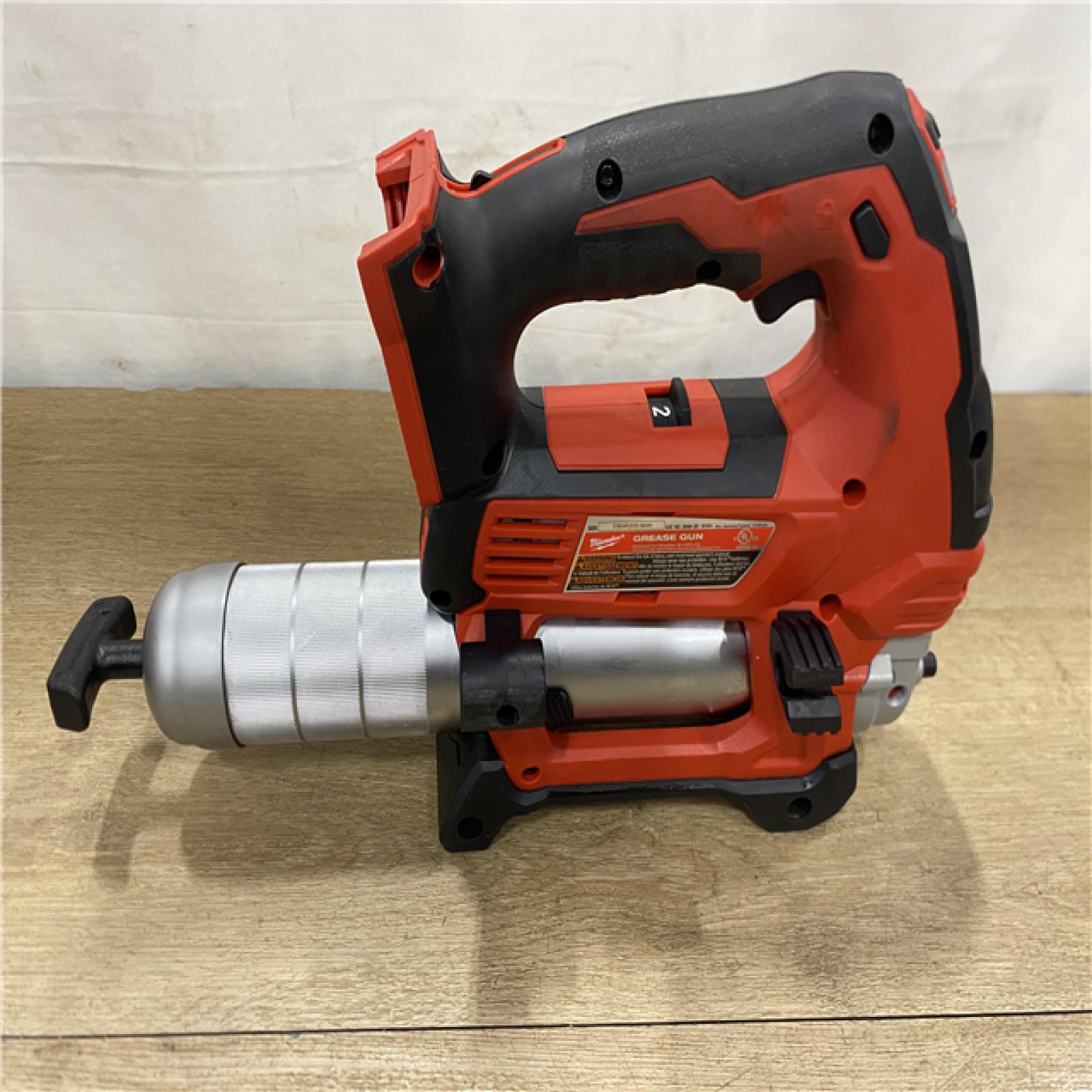 AS-IS Milwaukee 18V Lithium-Ion Cordless Grease Gun 2-Speed (Tool-Only)