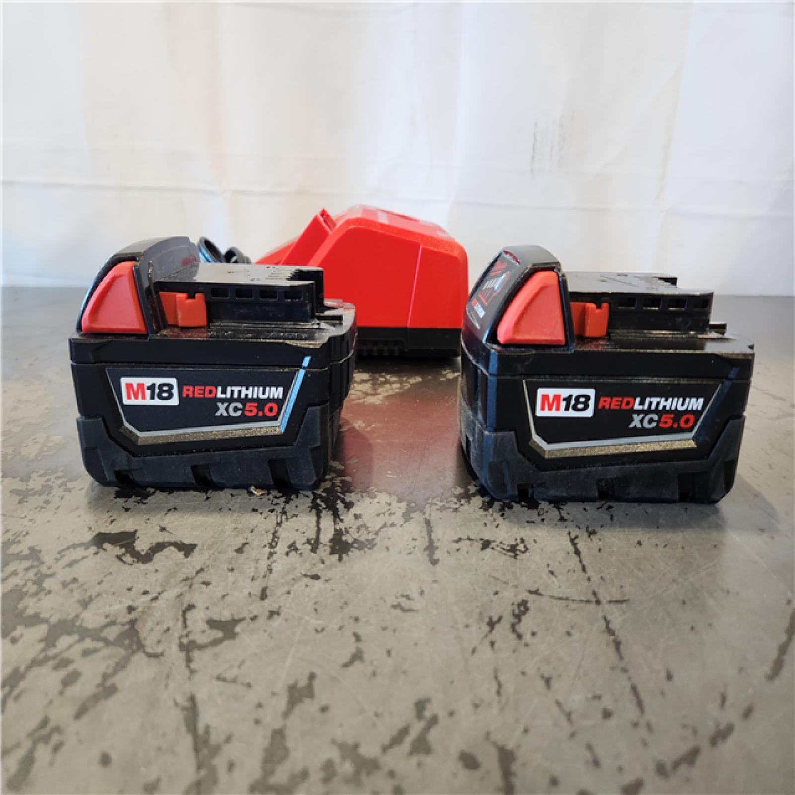 AS-IS- Milwaukee 18-Volt Lithium-Ion XC Starter Kit with Two 5.0Ah Batteries and Charger