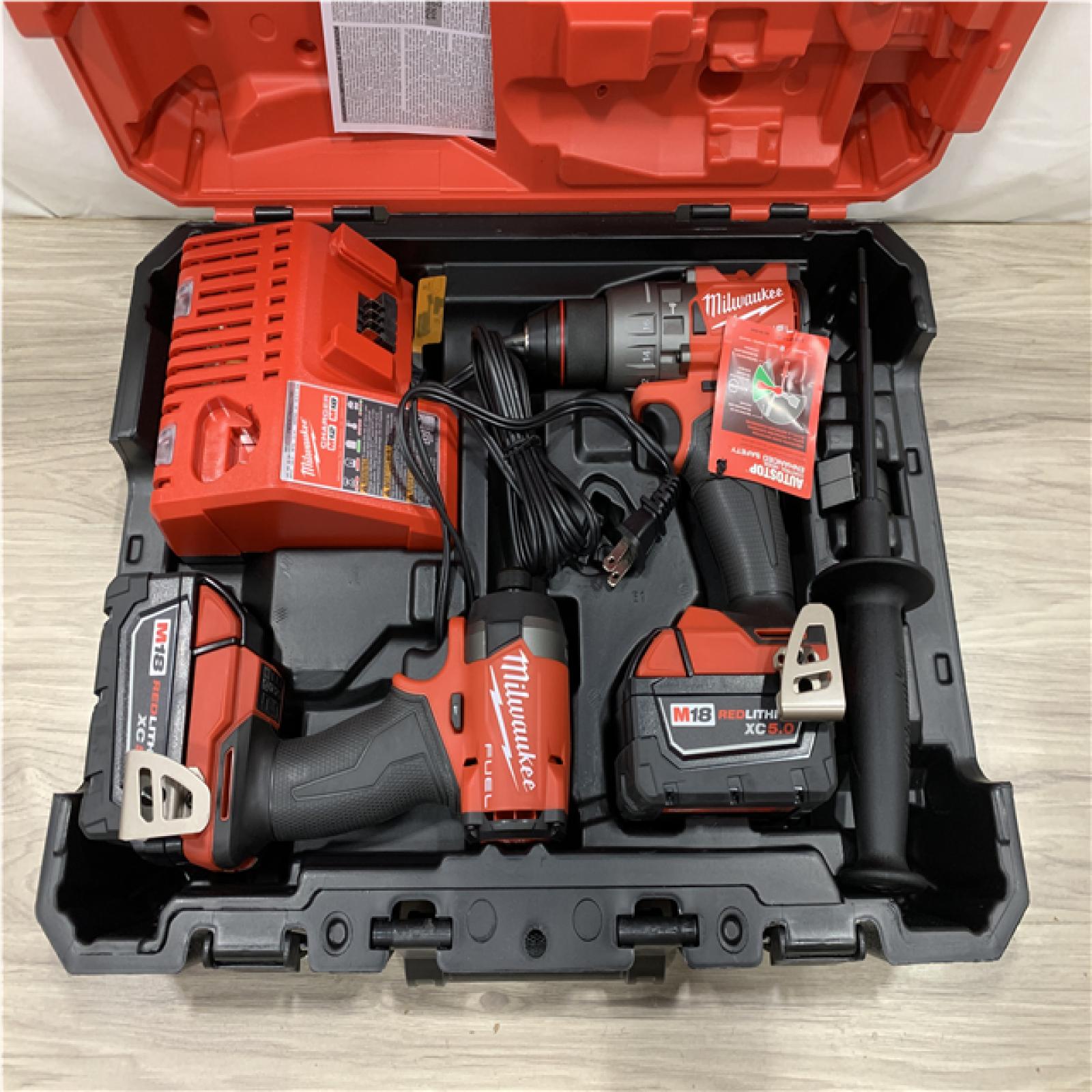 AS-IS Milwaukee FUEL 18V Lithium-Ion Brushless Cordless Hammer Drill and Impact Driver Combo Kit