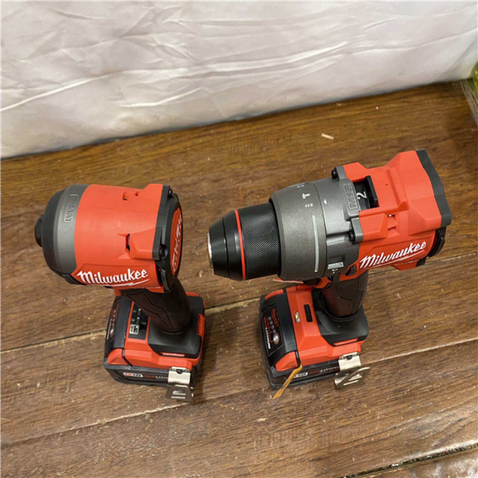AS-IS MILWAUKEE M18 FUEL 18V Lithium-Ion Brushless Cordless Hammer Drill and Impact Driver Combo Kit (2-Tool) with 2 Batteries