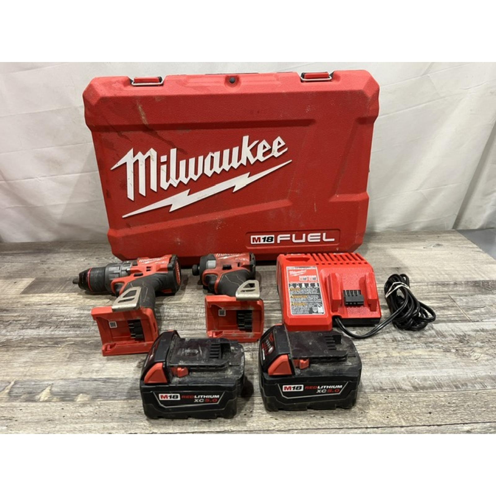 AS-IS Milwaukee FUEL 18V Lithium-Ion Brushless Cordless Hammer Drill and Impact Driver Combo Kit