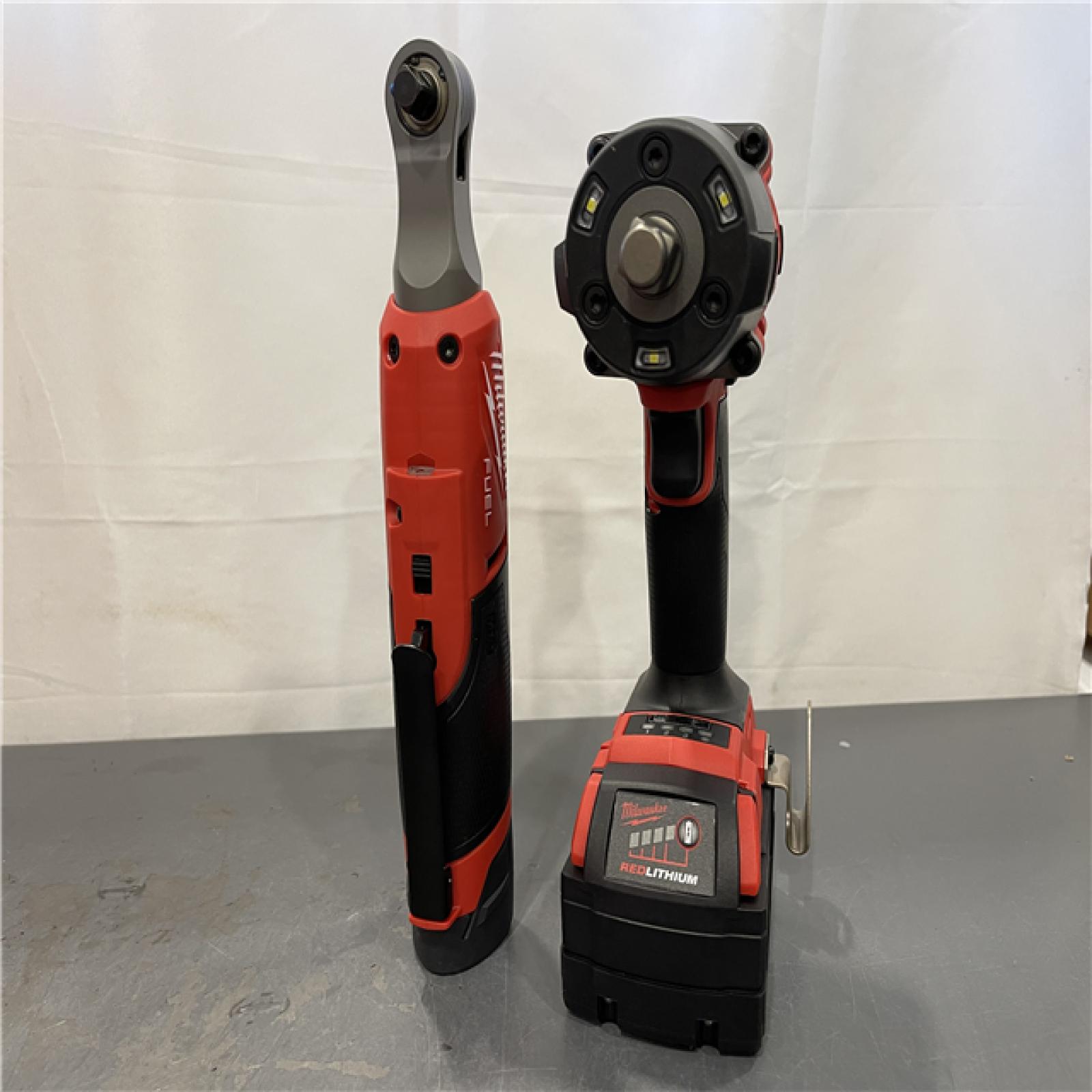 AS-IS - Milwaukee M18 FUEL 18V Cordless Mid Torque 1/2 in. Impact Wrench W/ M12 FUEL 3/8 in. Ratchet & Battery/Charger Combo Kit