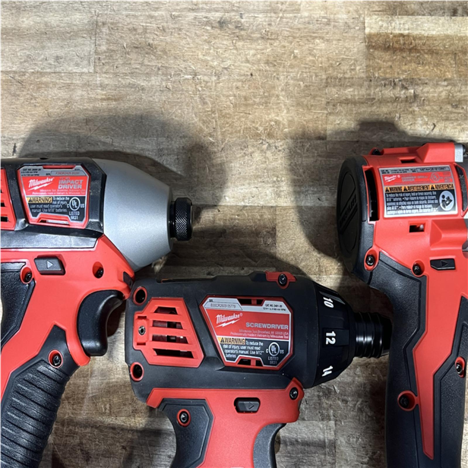 Houston Location Milwaukee Screwdriver and Impact Driver and Hammer Drill Driver and Batteries QTY/2 with Charger