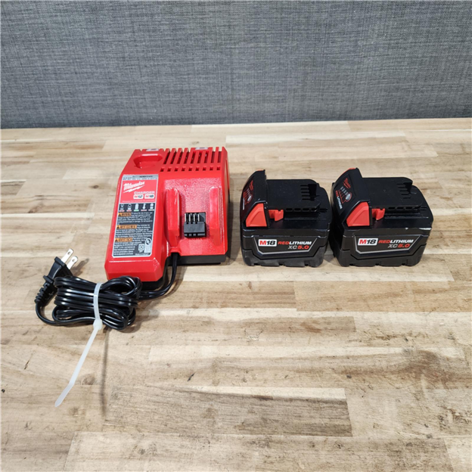 HOUSTON LOCATION - AS-IS MILWAUKEE 2 TOOL COMBO KIT W/ (2) BATTERY & CHARGER