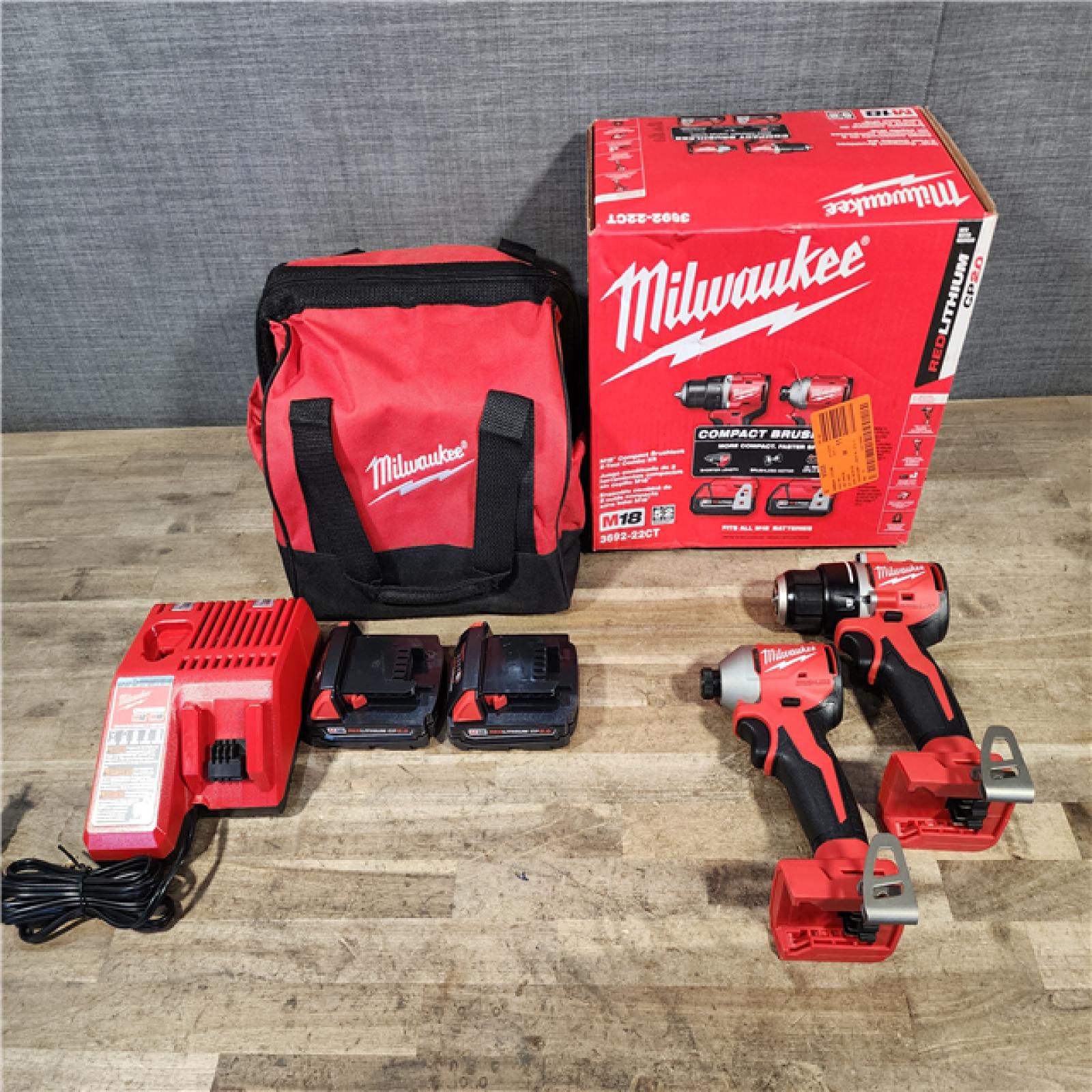 HOUSTON LOCATION - AS-IS Milwaukee M18 18V Lithium-Ion Brushless Cordless Compact Drill/Impact Combo Kit (2-Tool) W/(2) 2.0 Ah Batteries  Charger & Bag